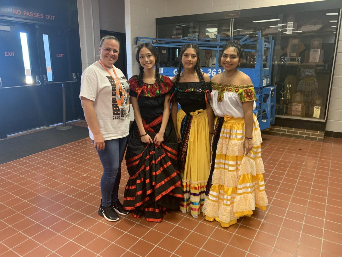 Ms. Lopez, Migdia Gomez Morales, Azul Escobar Perez, Alondra Castillo Salas before pep rally performance. 